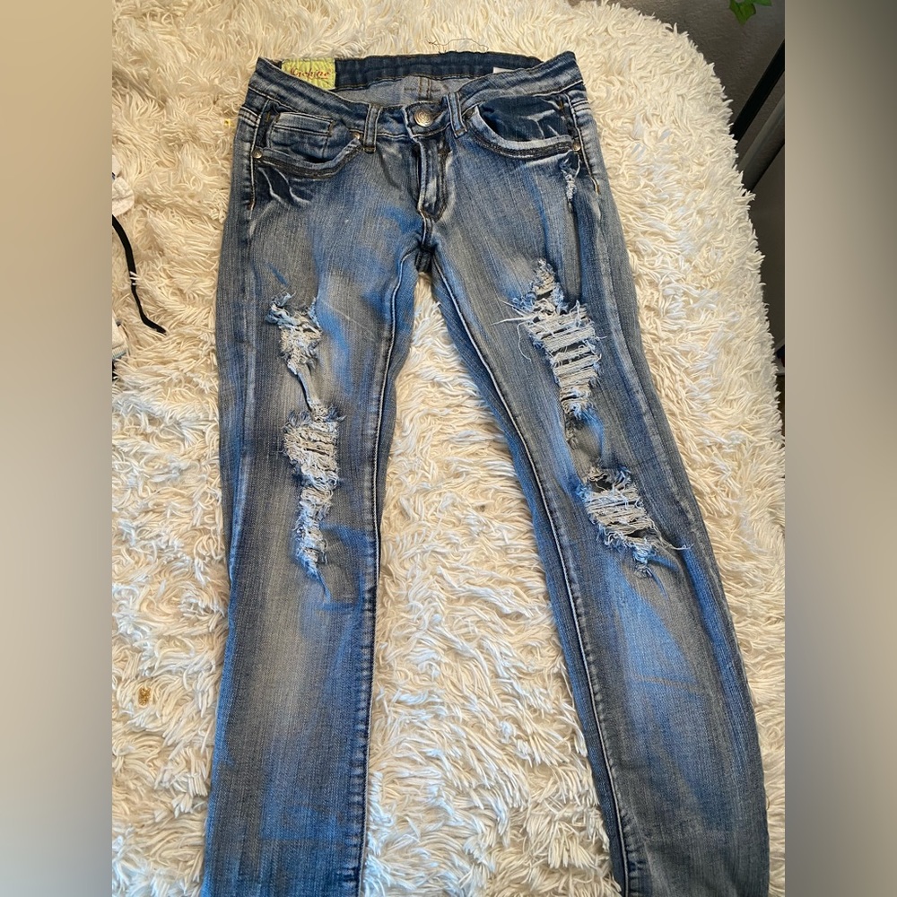 Machine low rise distressed jeans